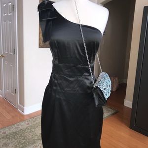 Black satin one shoulder adorned with a bow dress.